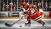 50x50-dalle-2024-01-25-010857-a-st-bernard-dog-playing-ice-hockey-shooting-a-slap-shot-at-the-goal-the-dog-is-wearing-a-red-hockey-helmet-a-red-hockey-jersey-with-green-and-whi.png